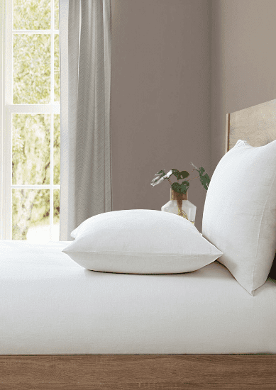 White fitted bed sheets with pillow from Lazy Linen