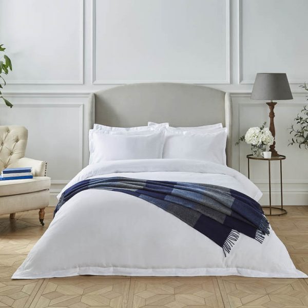 Liddell lambswool marine check blue blanket lying on a bed