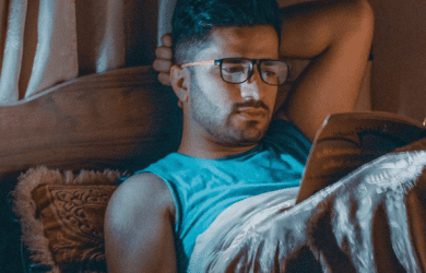 Man Reading In Bed